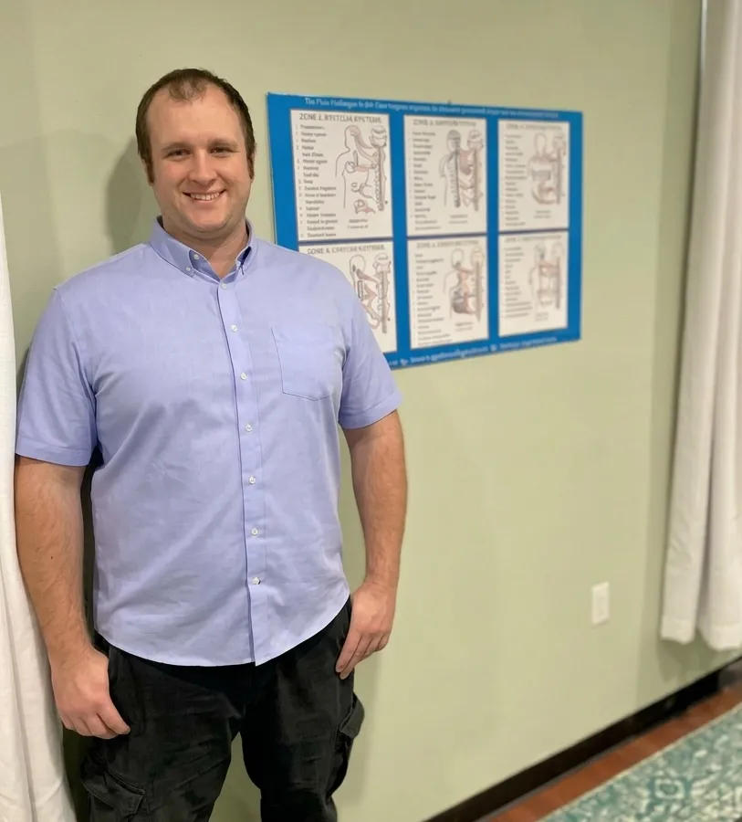 Dr. Tyler Randolph, certified chiropractor, providing care